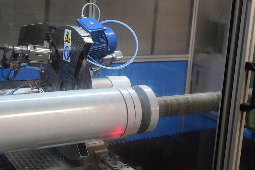 Cevenini Log Tape Slitter in Action Cutting Grey Anti Slip Tape 3