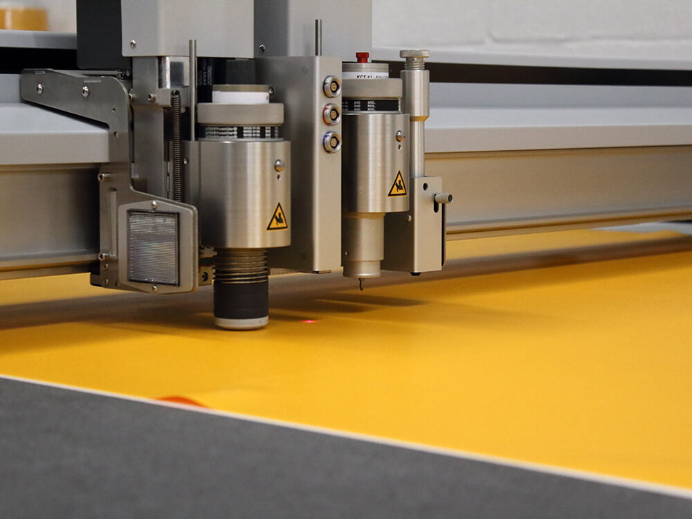 Zund Digital Die Cutting Machine Cutting Yellow Non Slip Material into Shoe Shapes 2