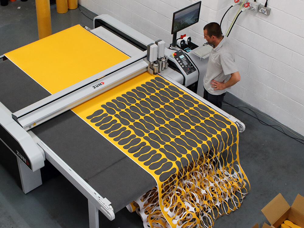 Zund Digital Die Cutting Machine Cutting Yellow Non Slip Material into Shoe Shapes 4